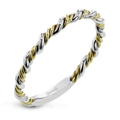 This ring is certainly a twist on a classic, with the band and halo formed from two tones of 18k gold twisted together, and the engagement ring set with .18 ctw of diamonds.