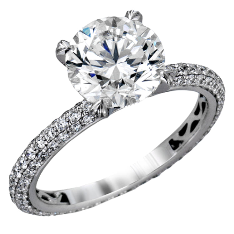 Presenting an eye-catching modern design, this white gold engagement ring and wedding band are highlighted by 1.45 ctw of round cut white diamonds.
